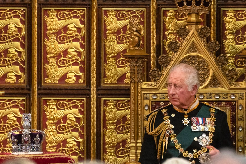 LONDON, ENGLAND - MAY 10: Prince Charles, Prince of Wales looks towards the Imperial State Crown as he delivers the Queen’s Speech during the state opening of Parliament at the House of Lords on May 10, 2022 in London, England. The State Opening of Parliament formally marks the beginning of the new session of Parliament. It includes Queen's Speech, prepared for her to read from the throne, by her government outlining its plans for new laws being brought forward in the coming parliamentary year. This year the speech will be read by the Prince of Wales as HM The Queen will miss the event due to ongoing mobility issues. (Photo by Dan Kitwood/Getty Images)