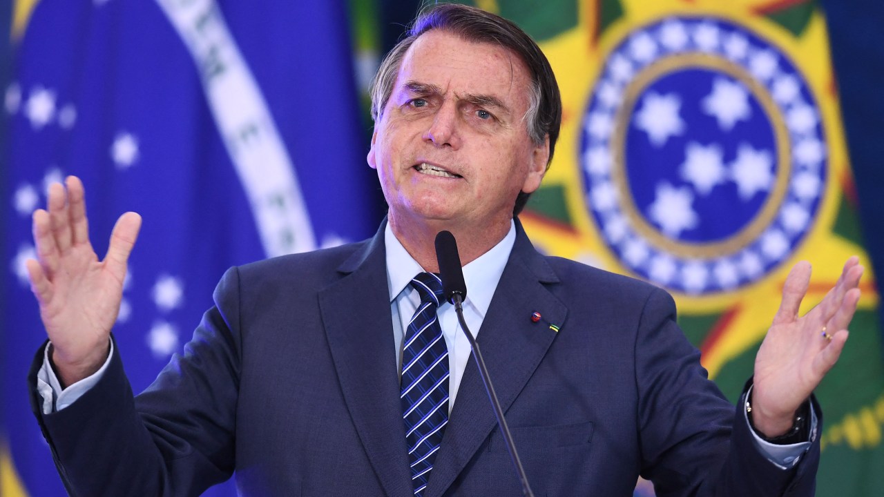 Brazilian President Jair Bolsonaro speaks during the launching event of the Week of Communication at the Planalto Palace in Brasilia, on May 5, 2021. - Bolsonaro called those who are against early treatment with Chloroquine against COVID-19 a 'scoundrel'. (Photo by EVARISTO SA / AFP)
