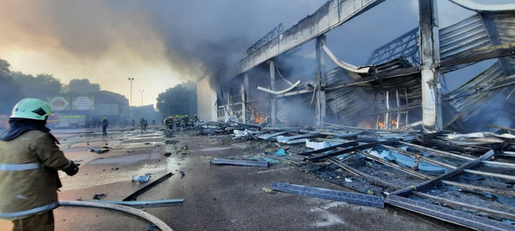 This handout picture taken and released by the Ukraine's State Emergency Service on June 27, 2022 shows firefighters putting out the fire in a mall hit by a Russian missile strike in the eastern Ukrainian city of Kremenchuk, killing at least two and injuring dozens more, Ukraine's President said. (Photo by UKRAINE EMERGENCY MINISTRY PRESS SERVICE / AFP) / RESTRICTED TO EDITORIAL USE - MANDATORY CREDIT "AFP PHOTO / UKRAINE EMMERGENCY SERVICE" - NO MARKETING NO ADVERTISING CAMPAIGNS - DISTRIBUTED AS A SERVICE TO CLIENTS