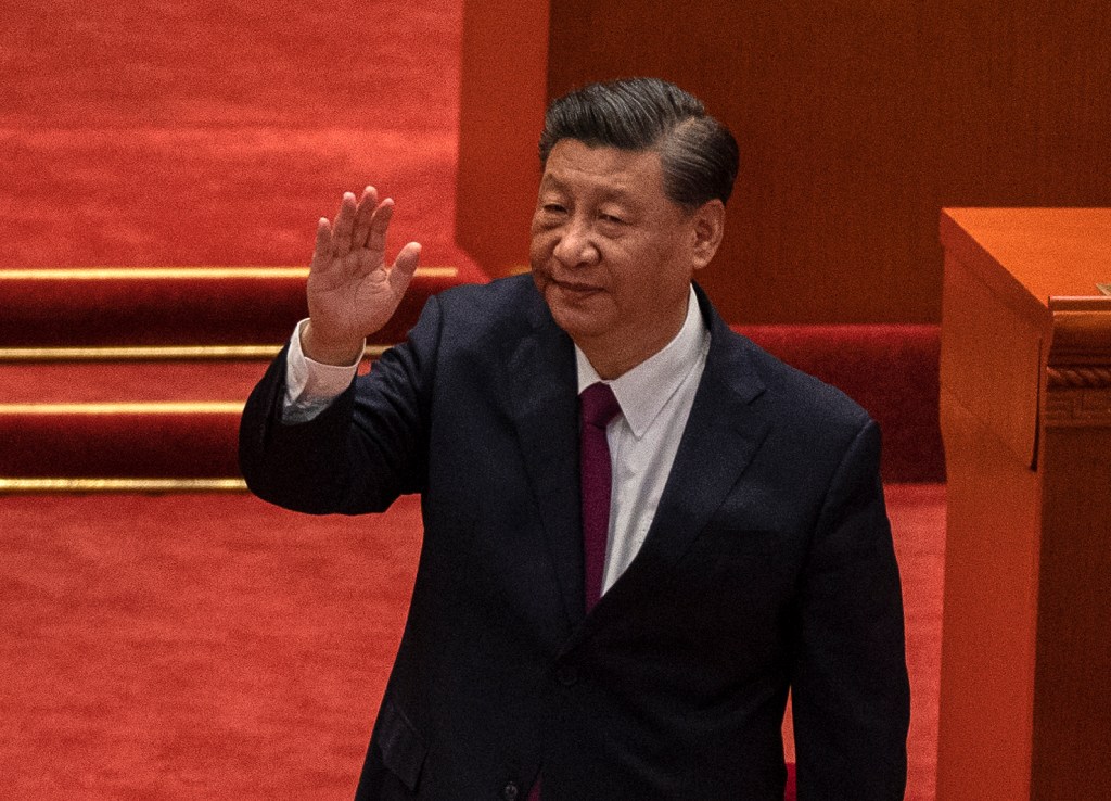BEIJING, CHINA - APRIL 08: Chinese President Xi Jinping waves after speaking during a ceremony to honour contributions to the Beijing 2022 Winter Olympics and Paralympics at the Great Hall of the People on April 8, 2022 in Beijing, China. (Photo by Kevin Frayer/Getty Images), CHINA - APRIL 08: Chinese President Xi Jinping waves after speaking during a ceremony to honour contributions to the Beijing 2022 Winter Olympics and Paralympics at the Great Hall of the People on April 8, 2022 in Beijing, China. (Photo by Kevin Frayer/Getty Images)