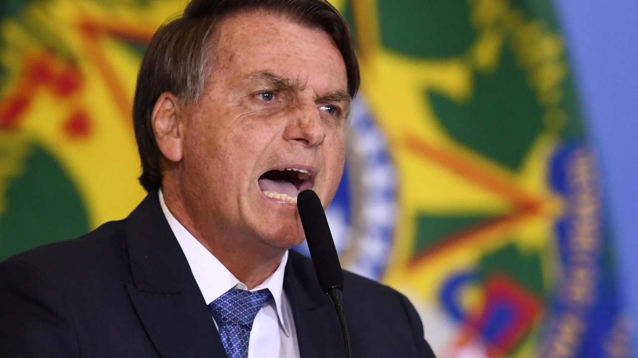 Brazilian President Jair Bolsonaro delivers a speech during a meeting called "Brazil for Life and Family" and promoted by an anti-abortion movement, at Planalto Palace in Brasilia, on June 7, 2022. - In his speech, Bolsonaro attacked the Supreme Court, the Electoral Justice and its judges. (Photo by EVARISTO SA / AFP)