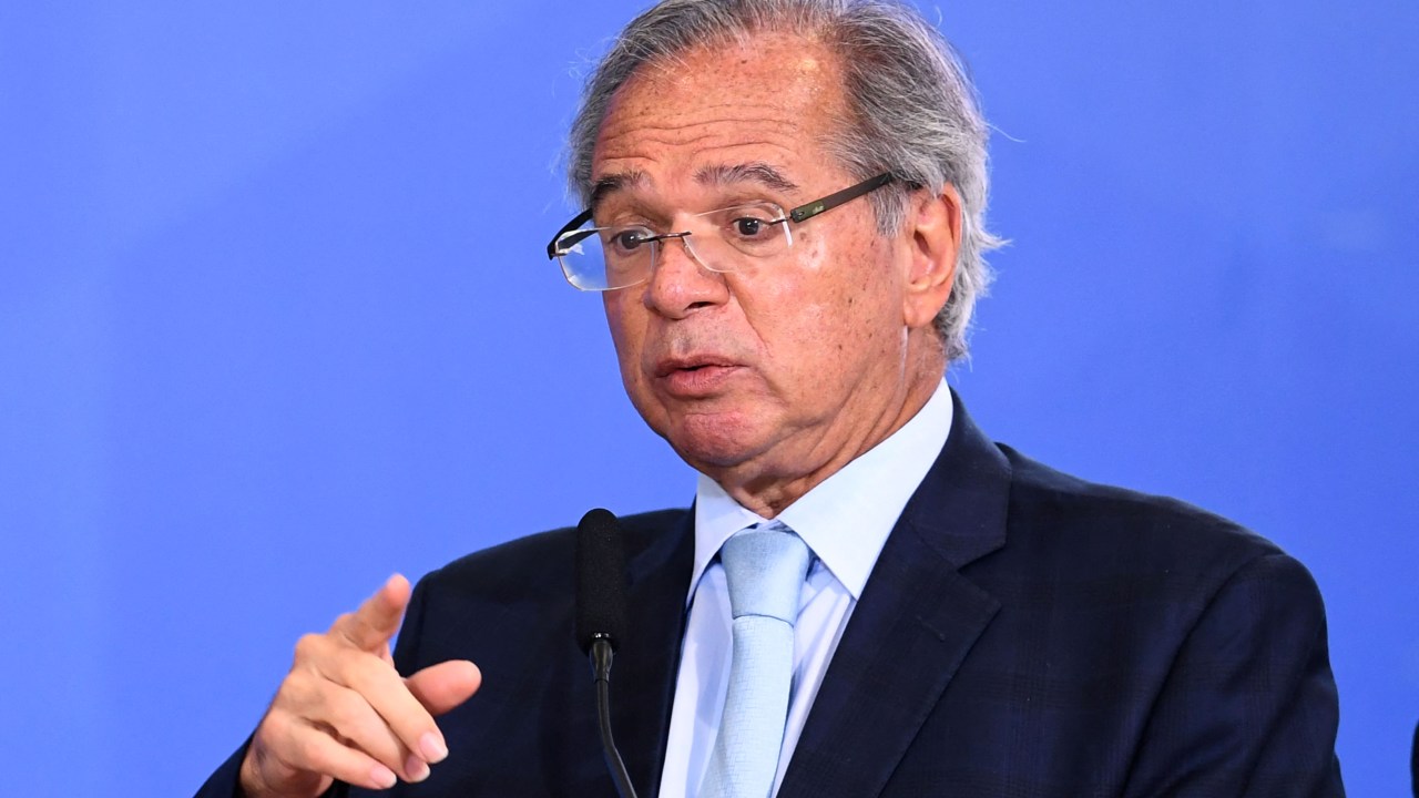 Brazilian Minister of Economy Paulo Guedes delivers a speech during an event to present the new national ID and passport at Planalto Palace in Brasilia on June 27, 2022. (Photo by EVARISTO SA / AFP)