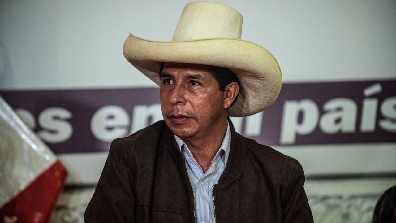 (FILES) In this file photo taken on June 15, 2021, Peru's leftist then presidential candidate Pedro Castillo, of the Peru Libre party, speaks during a press conference with the foreign press association at his party's headquarters in Lima. - Castillo celebrates a year in office on Thursday July 28, 2022, with a record of five fiscal investigations for alleged corruption and the persistent siege of a Congress dominated by the right that demands his resignation. (Photo by Ernesto BENAVIDES / AFP)