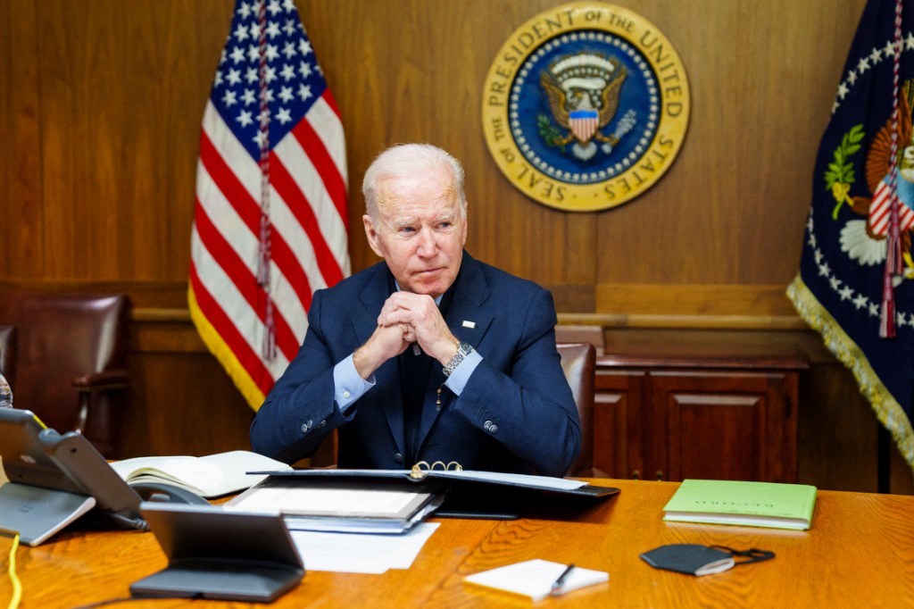 In this image released by the White House, US President Joe Biden speaks with Russian President Vladimir Putin from the presidential retreat in Camp David, Maryland, on February 12, 2022. - President Biden warned President Putin in the phone call that the US "will respond decisively and impose swift and severe costs on Russia" should it invade Ukraine. According to a readout from the White House, Biden stressed that "while the United States remains prepared to engage in diplomacy, in full coordination with our Allies and partners, we are equally prepared for other scenarios." (Photo by WHITE HOUSE / AFP) / RESTRICTED TO EDITORIAL USE - MANDATORY CREDIT "AFP PHOTO / The White House" - NO MARKETING NO ADVERTISING CAMPAIGNS - DISTRIBUTED AS A SERVICE TO CLIENTS