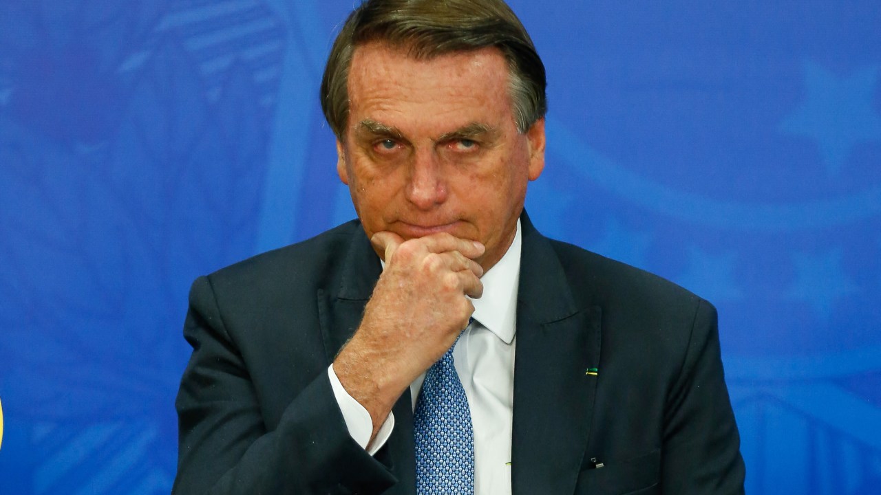 Brazilian President Jair Bolsonaro gestures during a tribute to the Brazilian athletes who won the second place in the general medal table of the Normandy 2022 Gymnasiade in Brasilia, on July 6, 2022. (Photo by Sergio Lima / AFP)