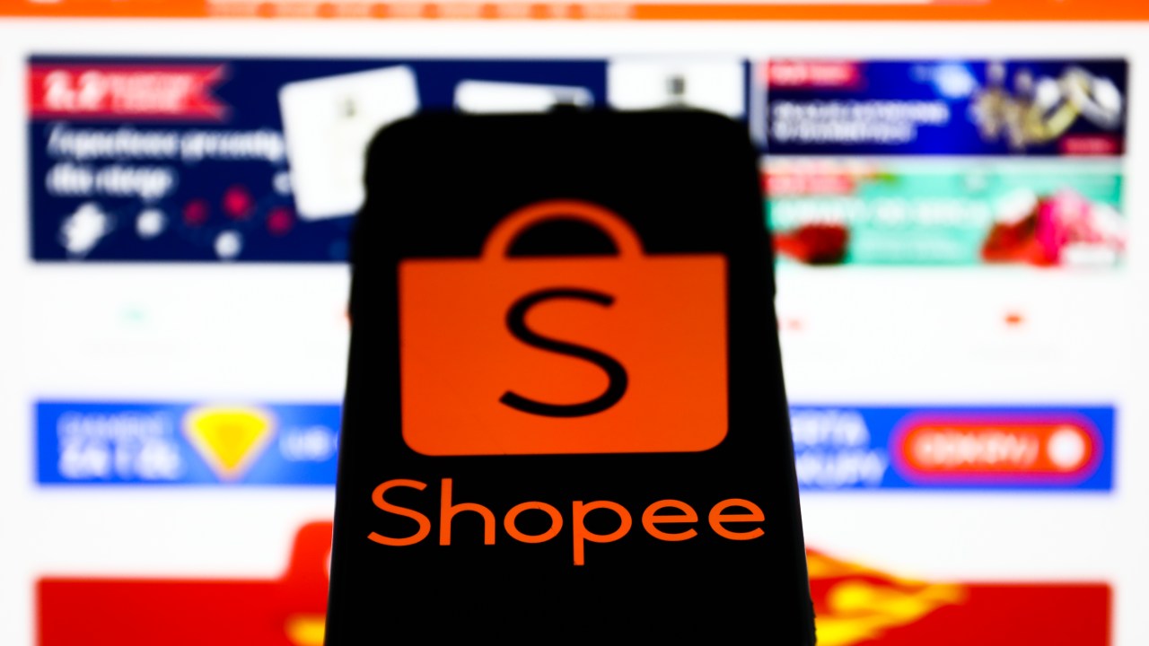 Shopee logo displayed on a phone screen and Shopee website displayed on a laptop screen are seen in this illustration photo taken in Krakow, Poland on January 25, 2022. (Photo by Jakub Porzycki/NurPhoto via Getty Images)