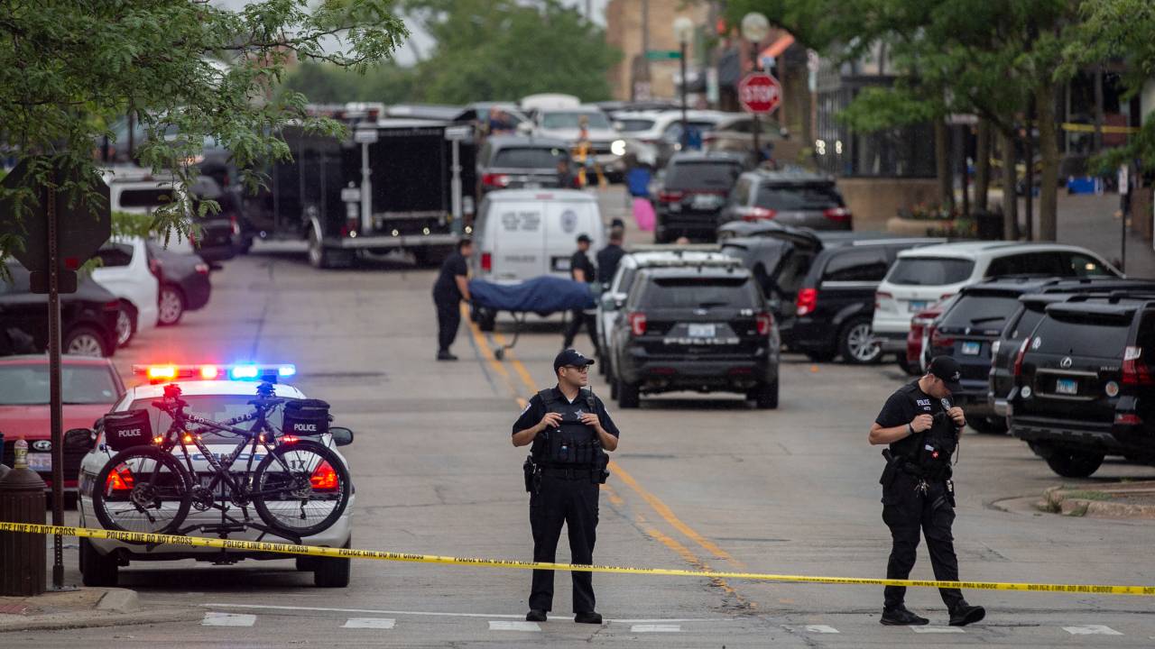 HIGHLAND PARK, IL - JULY 04: First responders take away victims from the scene of a mass shooting at a Fourth of July parade on July 4, 2022 in Highland Park, Illinois. At least six people were killed and 19 injured, according to published reports. (Photo by Jim Vondruska/Getty Images)