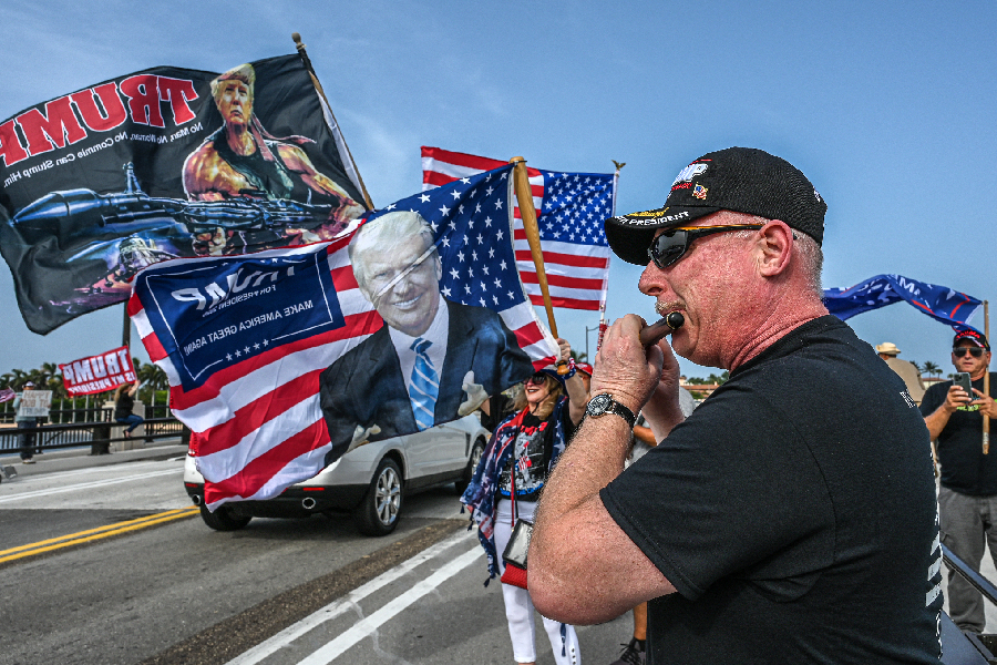 Supporters of former US President Donald Trump gather near his residence at Mar-A-Lago in Palm Beach, Florida, on August 9, 2022.