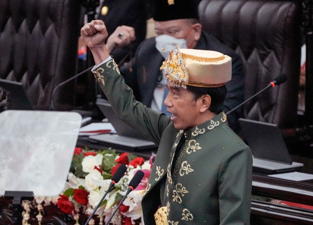 Indonesian President Joko Widodo gestures during his annual speech at the parliament in Jakarta on August 16, 2022, on the eve of the country's Independence Day celebrations. (Photo by TATAN SYUFLANA / POOL / AFP)