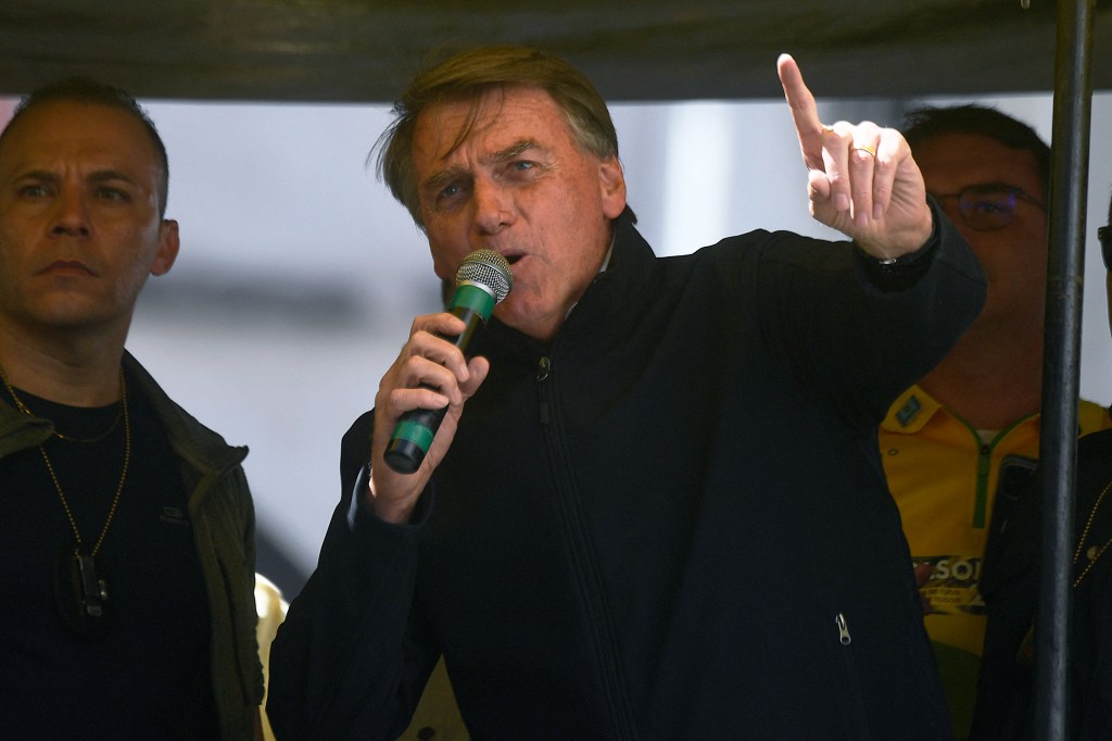 Brazil's President Jair Bolsonaro speaks during the launching of his re-election campaign for the upcoming national elections in October, in Juiz de Fora, Minas Gerais state, Brazil, on August 16, 2022. - Bolsonaro, 67, launched his campaign with a rally in Juiz de Fora, the small southeastern city where an attacker stabbed and nearly killed him during his 2018 campaign. The attack cemented Bolsonaro in the minds of die-hard supporters as "The Myth" -- a hero swooping in to rough up the political establishment and speak his mind with tough-talking clarity. (Photo by MAURO PIMENTEL / AFP)
