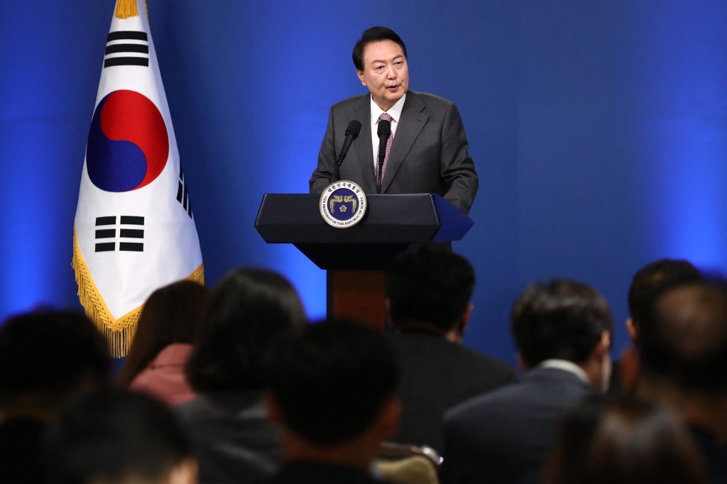 South Korean President Yoon Suk-yeol delivers a speech during his news conference to mark his first 100 days in office at the presidential office in Seoul on August 17, 2022. (Photo by Chung Sung-Jun / POOL / AFP)