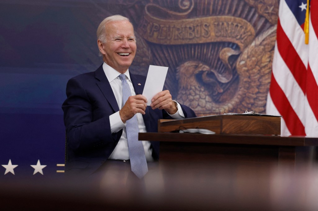 WASHINGTON, DC - JULY 28: U.S. President Joe Biden reads a note from an aide saying that the Creating Helpful Incentives to Produce Semiconductors (CHIPS) for America Act had received enough yes votes in the House of Representatives to pass during a meeting in the South Court Auditorium of the White House on July 28, 2022 in Washington, DC. President Biden held the meeting on the U.S. Economy with CEOs and members of his Cabinet. Anna Moneymaker/Getty Images/AFP (Photo by Anna Moneymaker / GETTY IMAGES NORTH AMERICA / Getty Images via AFP)