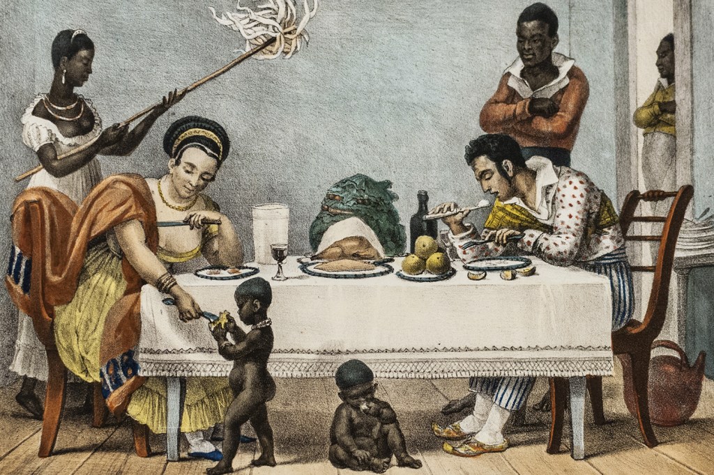 EM FAMÍLIA - Uma cena típica de refeição no Rio de Janeiro: entre frutas, mandioca e cativos escravizados -