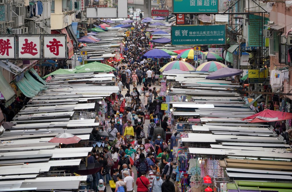 HONG KONG, CHINA - APRIL 18: People wearing face masks visit Mongkok Fa Yuen Street amid the coronavirus outbreak on April 18, 2020 in Hong Kong, China. (Photo by Zhang Wei/China News Service via Getty Images)