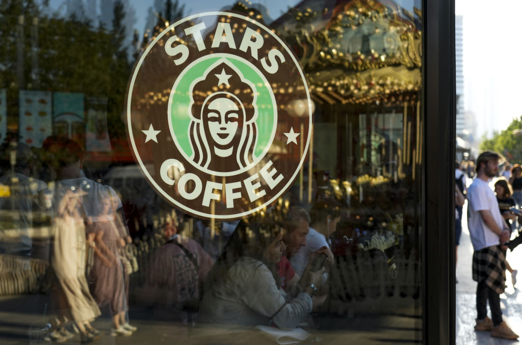 MOSCOW, RUSSIA - AUGUST 18: The Stars Coffee logo is seen on a window after former Starbucks coffee shops are reopened as Stars Coffee in Moscow, Russia on August 18, 2022. The rebranded coffee shops are owned by Russian businessman Anton Pinskiy and Russian rapper Timur Yunusov, known as Timati. Starbucks suspended its businesses in Russia in March, and pulled out of the country in May. (Photo by Pavel Pavlov/Anadolu Agency via Getty Images)
