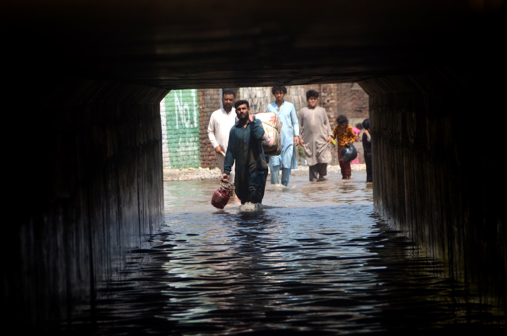 PESHAWAR, PAKISTAN - AUGUST 31: A general view of a flooded area as displaced people are seen trying to survive following the deadly climate catastrophe in Peshawar, Khyber Pakhtunkhwa, Pakistan on August 31, 2022. Flash floods triggered by destructive monsoon rains have killed more than 1,000 people and injured thousands more since June. (Photo by Hussain Ali/Anadolu Agency via Getty Images)