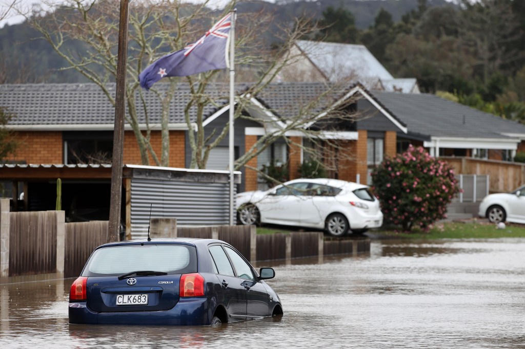 AUCKLAND, NEW ZEALAND - AUGUST 31: Cars in Rheingold Place in Huapai are underwater as heavy rain causes extensive flooding and destruction on August 31, 2021 in Auckland, New Zealand. Many homes have been evacuated after flash flooding hit the area due to heavy rainfall. (Photo by Fiona Goodall/Getty Images)