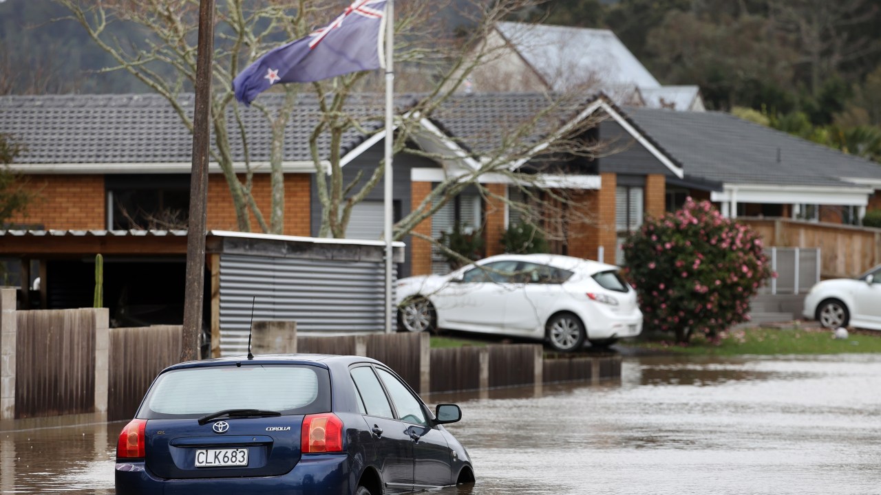 AUCKLAND, NEW ZEALAND - AUGUST 31: Cars in Rheingold Place in Huapai are underwater as heavy rain causes extensive flooding and destruction on August 31, 2021 in Auckland, New Zealand. Many homes have been evacuated after flash flooding hit the area due to heavy rainfall. (Photo by Fiona Goodall/Getty Images)