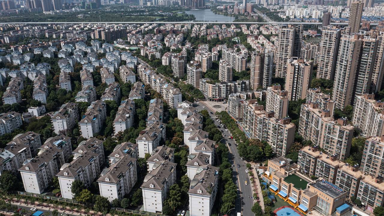 WUHAN, CHINA - SEPTEMBER 26: (CHINA OUT) An aerial view shows the Evergrande Changqing community on September 26, 2021 in Wuhan, Hubei Province, China. In 2015, Evergrande real estate acquired four super large projects in Haikou, Wuhan and Huizhou, with a total construction area of nearly 4 million square meters and a total amount of 13.5 billion yuan. Evergrande, China's largest property developer, is facing a liquidity crisis with total debts of around $300 billion. The problems faced by the company could impact China’s economy, and the global economy at large.(Photo by Getty Images)