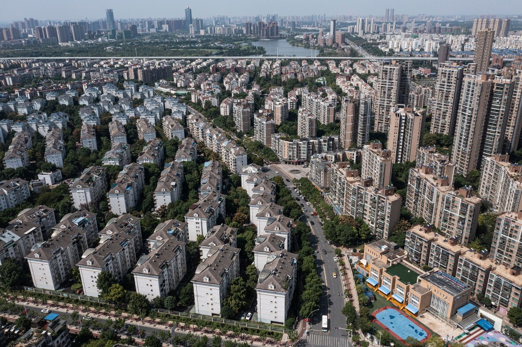 WUHAN, CHINA - SEPTEMBER 26: (CHINA OUT) An aerial view shows the Evergrande Changqing community on September 26, 2021 in Wuhan, Hubei Province, China. In 2015, Evergrande real estate acquired four super large projects in Haikou, Wuhan and Huizhou, with a total construction area of nearly 4 million square meters and a total amount of 13.5 billion yuan. Evergrande, China's largest property developer, is facing a liquidity crisis with total debts of around $300 billion. The problems faced by the company could impact China’s economy, and the global economy at large.（Photo by Getty Images)