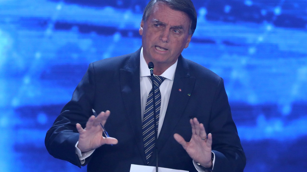 SAO PAULO, BRAZIL - AUGUST 28: President of Brazil and presidential candidate Jair Bolsonaro speaks during the first presidential debate ahead of October 02 elections at TV Bandeirantes studios on August 28, 2022 in Sao Paulo, Brazil. Brazilians will vote for president on October 2 and polls predict a close fight between the incumbent Bolsonaro and former president Lula Da Silva. (Photo by Rodrigo Paiva/Getty Images)