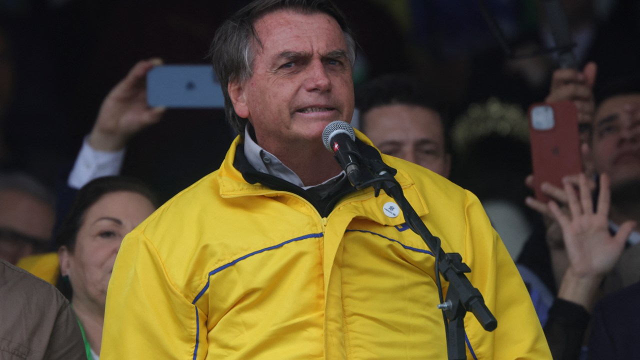 Brazilian President Jair Bolsonaro speaks during the 45th Expointer agricultural fair at Assis Brasil State Park in Esteio, Brazil, on September 2, 2022. - Expointer is one of the largest open-air agricultural fairs in Latin America. (Photo by SILVIO AVILA / AFP)