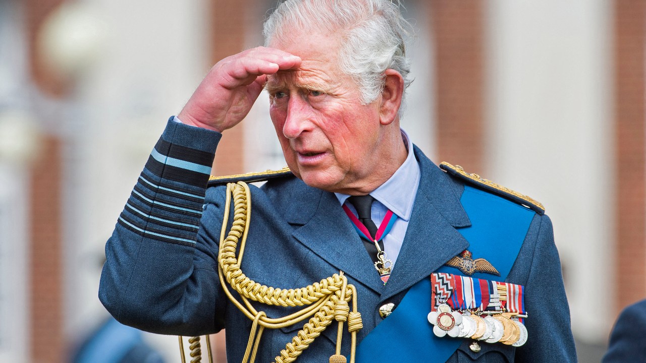 (FILES) In this file photo taken on July 16, 2020 Marshal of The Royal Air Force, Britain's Prince Charles, Prince of Wales gestures as he talks to cadets after the Graduation Ceremony of the Queens Squadron and Sovereigns Review at RAF College Cranwell in eastern England. - Charles has spent virtually his entire life waiting to succeed his mother, Queen Elizabeth II, even as he took on more of her duties and responsibilities as she aged. But the late monarch's eldest son, 73, made the most of his record-breaking time as the longest-serving heir to the throne by forging his own path. (Photo by JULIAN SIMMONDS / POOL / AFP)