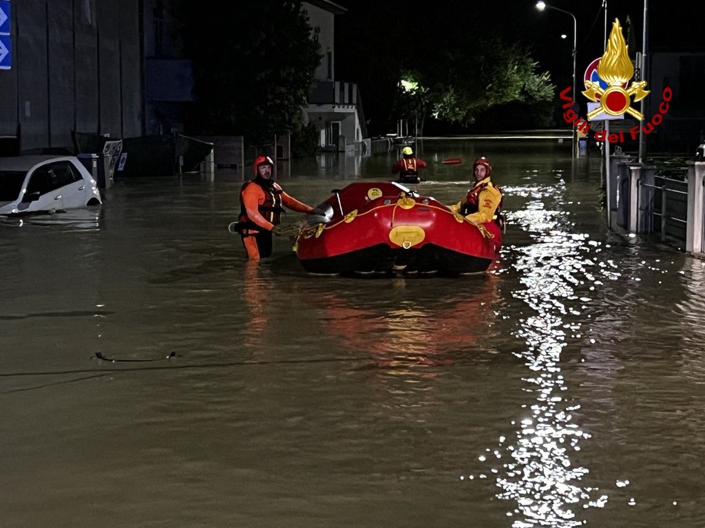 This handout picture made available by Vigili Del Fuoco, the Italian national firefighting and rescue service, shows firefighters operating during a rescue operation following an overnight rain bomb in Senigallia, Ancona province, Italy, on September 16, 2022. - At least ten people died and four are reported missing following flash floods due to rain bombs and heavy winds in the province of Ancona. (Photo by Handout / AFP) / RESTRICTED TO EDITORIAL USE - MANDATORY CREDIT "AFP PHOTO / VIGLILI DEL FUOCIO" - NO MARKETING NO ADVERTISING CAMPAIGNS - DISTRIBUTED AS A SERVICE TO CLIENTS