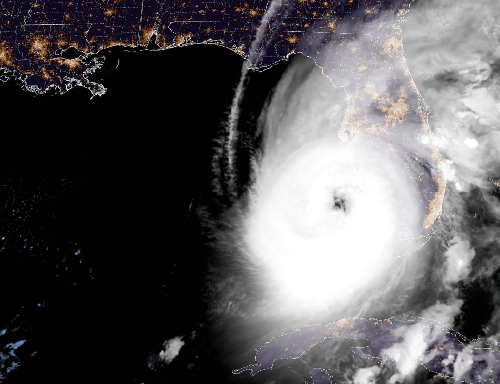 This National Oceanic and Atmospheric Administration (NOAA) satellite handout image shows tropical Hurricane Ian approaching Florida, on September 28, 2022 at 11:36 UTC. - Ian strengthened to a Category 4 storm as it headed towards the US state of Florida on Wednesday, with forecasters warning of life-threatening storm surges and "devastating" winds after it reportedly killed two and left millions without power in Cuba. (Photo by Handout / NOAA/GOES / AFP) / RESTRICTED TO EDITORIAL USE - MANDATORY CREDIT "AFP PHOTO / NOAA/GOES" - NO MARKETING NO ADVERTISING CAMPAIGNS - DISTRIBUTED AS A SERVICE TO CLIENTS