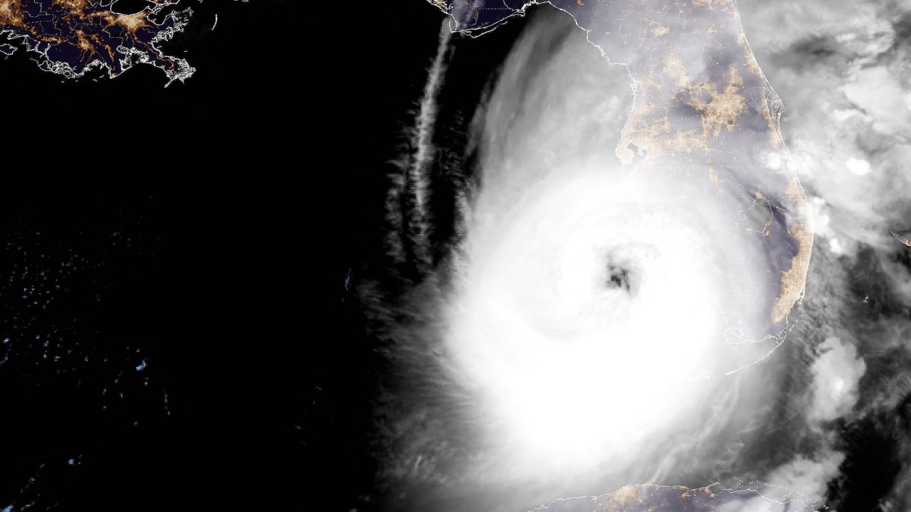 This National Oceanic and Atmospheric Administration (NOAA) satellite handout image shows tropical Hurricane Ian approaching Florida, on September 28, 2022 at 11:36 UTC. - Ian strengthened to a Category 4 storm as it headed towards the US state of Florida on Wednesday, with forecasters warning of life-threatening storm surges and "devastating" winds after it reportedly killed two and left millions without power in Cuba. (Photo by Handout / NOAA/GOES / AFP) / RESTRICTED TO EDITORIAL USE - MANDATORY CREDIT "AFP PHOTO / NOAA/GOES" - NO MARKETING NO ADVERTISING CAMPAIGNS - DISTRIBUTED AS A SERVICE TO CLIENTS