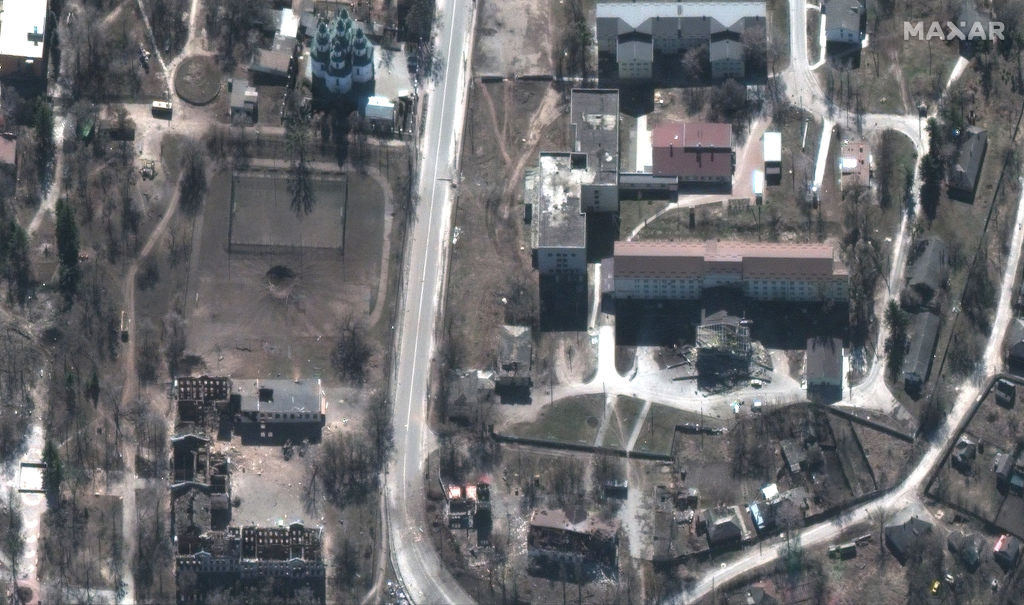 RUSSIANS INVADE UKRAINE -- MARCH 24, 2022: 17 Maxar closeup satellite imagery of damaged buildings and the hospital, downtown Izyum, Ukraine. 24march2022_wv3. Please use: Satellite image (c) 2022 Maxar Technologies.