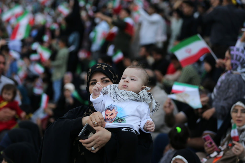 TEHRAN, IRAN - MAY 26: An Iranian woman and her baby are seen singing the "Hello Commander" anthem, which is widely covered on social media in Iran, at Azadi Stadium during the program of collective singing the "Hello Commander" anthem in Tehran, Iran on May 26, 2022. Programs to sing the "Hello Commander" anthem, which started on March 18, the birthday of Mahdi, known as the 12th Imam in Iran, spread throughout the country in a short time. (Photo by Fatemeh Bahrami/Anadolu Agency via Getty Images)