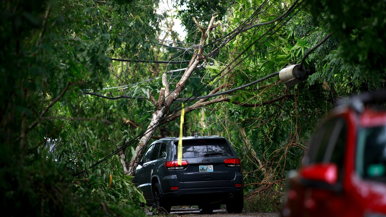CABO ROJO, PUERTO RICO - SEPTEMBER 20: Cars drive through road PR-307 on September 20, 2022 in Cabo Rojo, Puerto Rico. The island awoke to a general island power outage after Hurricane Fiona struck this caribbean nation two days ago. (Photo by Jose Jimenez/Getty Images)