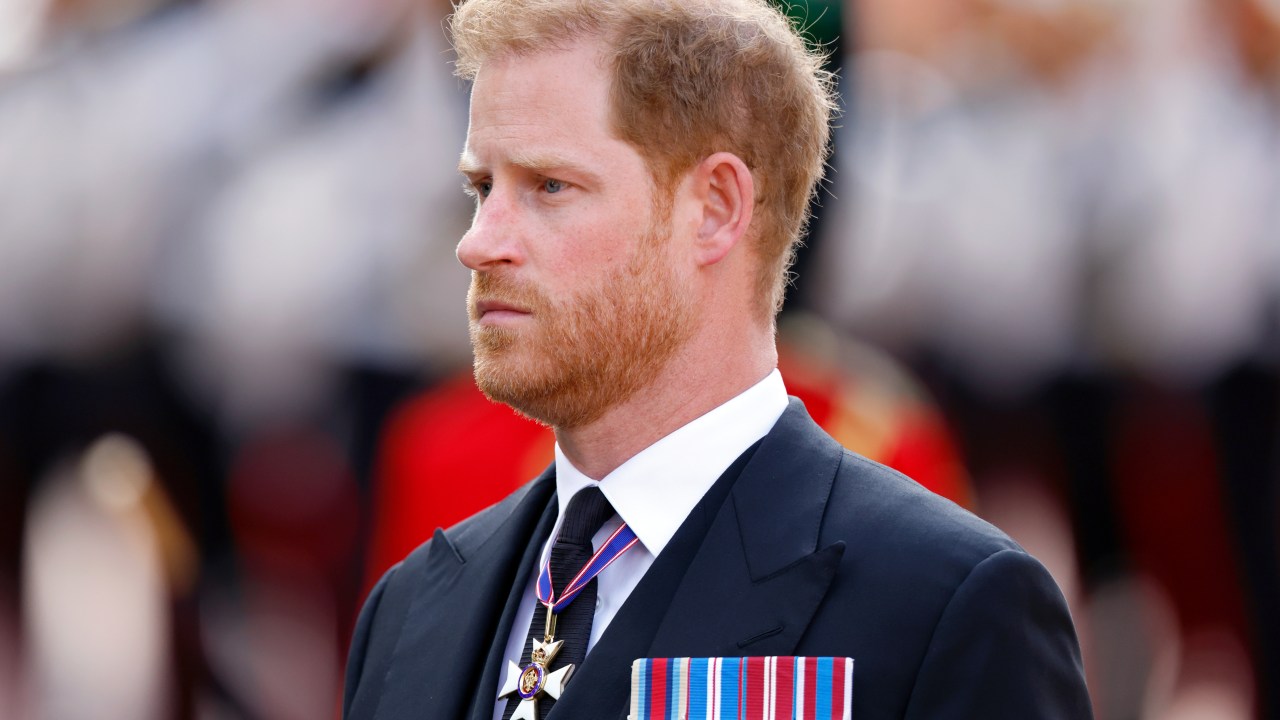 LONDON, UNITED KINGDOM - SEPTEMBER 14: (EMBARGOED FOR PUBLICATION IN UK NEWSPAPERS UNTIL 24 HOURS AFTER CREATE DATE AND TIME) Prince Harry, Duke of Sussex walks behind Queen Elizabeth II's coffin as it is transported on a gun carriage from Buckingham Palace to The Palace of Westminster ahead of her Lying-in-State on September 14, 2022 in London, United Kingdom. Queen Elizabeth II's coffin is taken in procession on a Gun Carriage of The King's Troop Royal Horse Artillery from Buckingham Palace to Westminster Hall where she will lay in state until the early morning of her funeral. Queen Elizabeth II died at Balmoral Castle in Scotland on September 8, 2022, and is succeeded by her eldest son, King Charles III. (Photo by Max Mumby/Indigo/Getty Images)