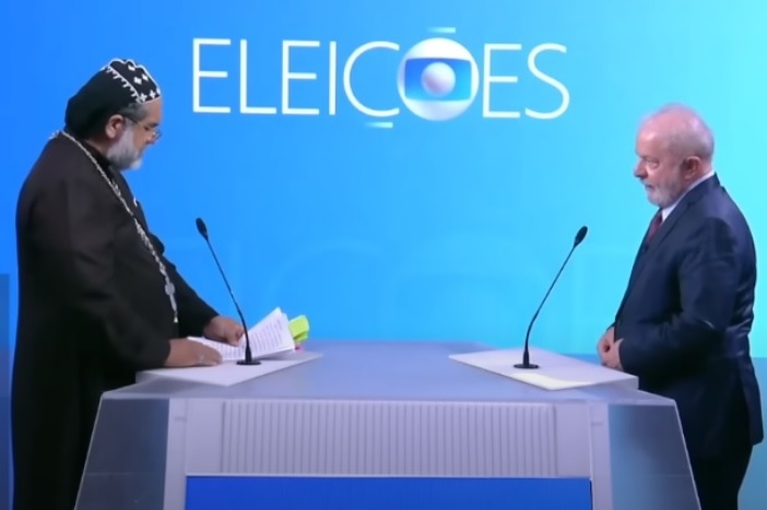 Os candidatos à Presidência Padre Kelmon (PTB) e Luiz Inácio Lula da Silva (PT), durante debate da TV Globo