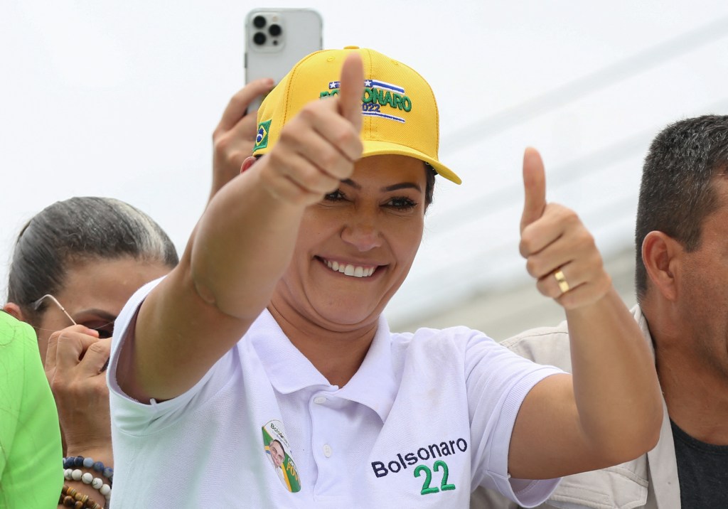 Brazil's First Lady Michelle Bolsonaro greets supporters before arriving to an event called "Women for Brazil" in Manaus, Amazonas state, Brazil, on October 11, 2022. (Photo by Michael DANTAS / AFP)