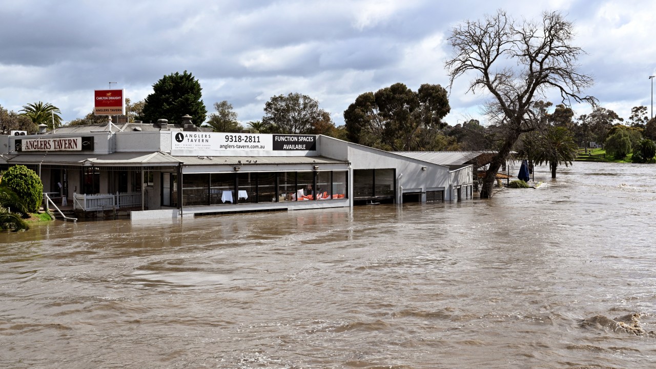 A tavern is inundated by water during flooding in the Melbourne suburb of Maribyrnong on October 14, 2022. (Photo by William WEST / AFP)