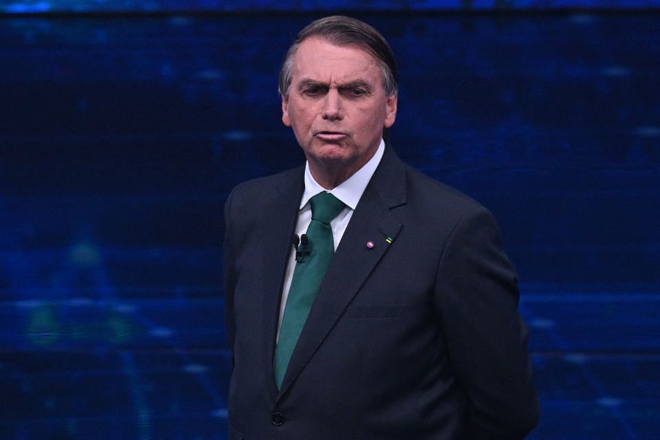 Brazilian President and presidential candidate Jair Bolsonaro speaks during a televised presidential debate in Sao Paulo, Brazil, on October 16, 2022. - President Jair Bolsonaro and former President Luiz Inácio Lula da Silva face each other this Sunday night in the first face-to-face debate, in which they will try to take advantage 14 days before the second round of the presidential elections in Brazil. (Photo by NELSON ALMEIDA / AFP)