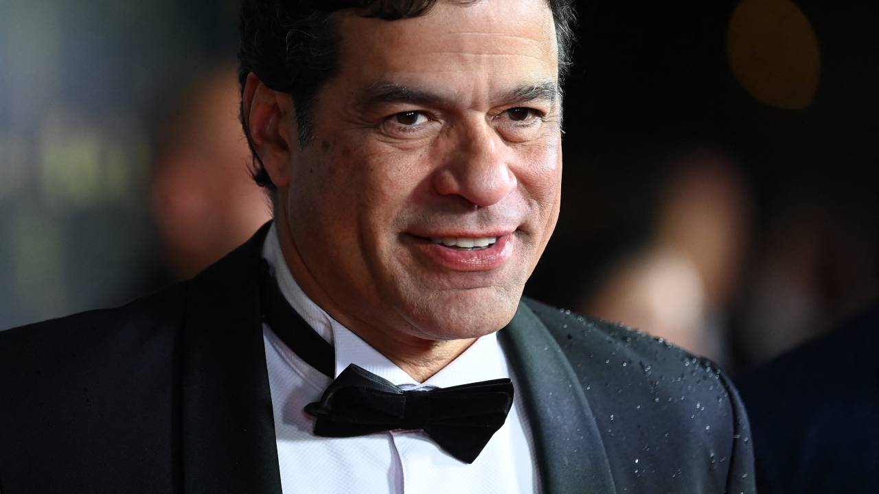 French-Brazilian former football player Rai poses upon arrival to attend the 2022 Ballon d'Or France Football award ceremony at the Theatre du Chatelet in Paris on October 17, 2022. (Photo by FRANCK FIFE / AFP)
