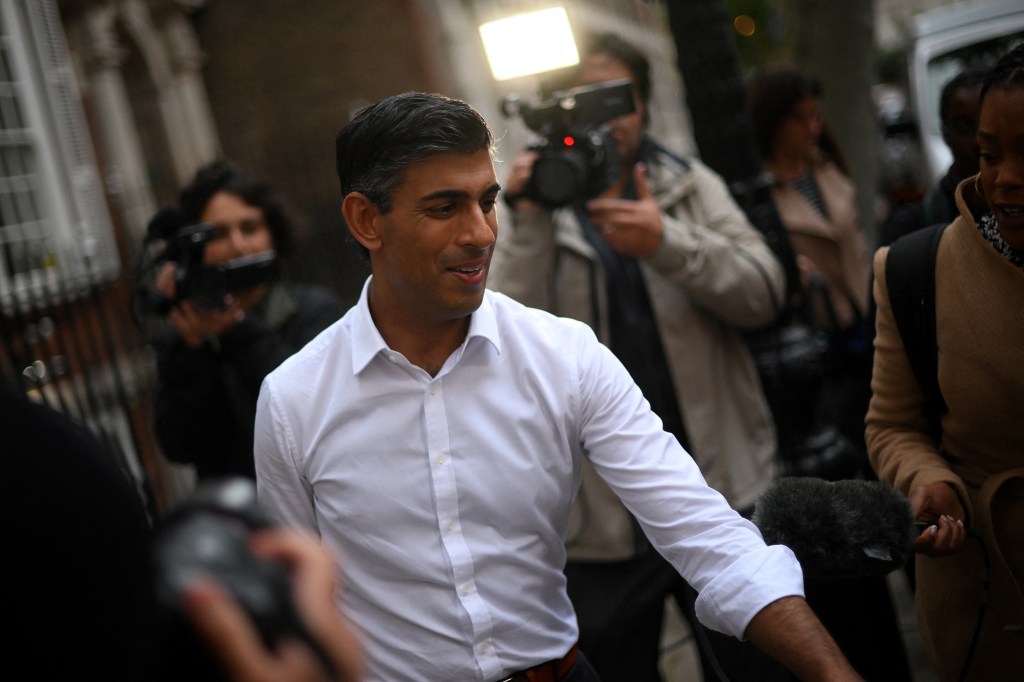 Britain's former Chancellor of the Exchequer, Conservative MP, Rishi Sunak leaves from an office in central London on October 23, 2022. - British Conservative Rishi Sunak on Sunday announced he is standing to be prime minister, just weeks after failing in a first attempt and setting up a potentially bruising battle with his former boss Boris Johnson. (Photo by Daniel LEAL / AFP)