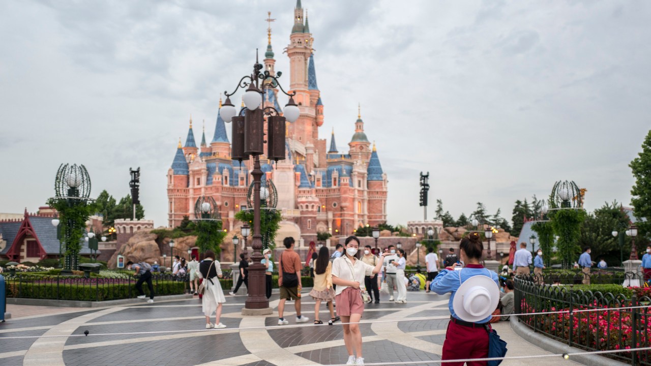 HANGHAI, CHINA - JUNE 30: Tourists visit the Shanghai Disney Resort on the reopening day on June 30, 2022 in Shanghai, China. Shanghai Disney Resort reopened on Thursday after more than three months of closure due to the COVID-19 outbreak. (Photo by VCG/VCG via Getty Images)