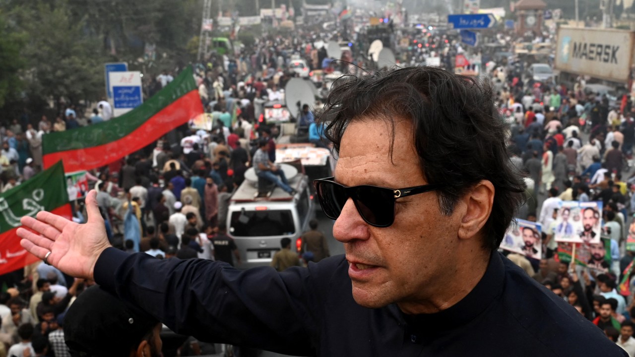 In this photograph taken on November 1, 2022, Pakistan's former prime minister Imran Khan speaks while taking part in an anti-government march in Gujranwala. - Khan was shot in the foot at a political rally on November 3, 2022 but he is in a stable condition, an aide said. (Photo by Arif ALI / AFP)