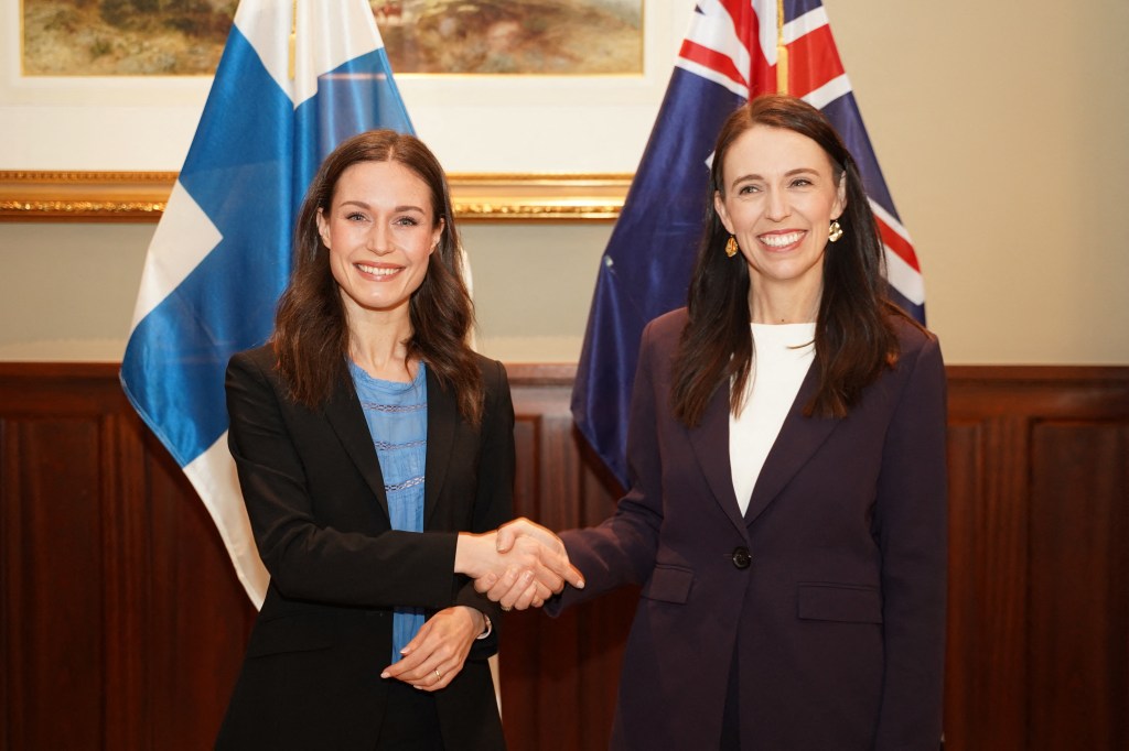 Finlands Prime Minister Sanna Marin (L) shakes hands with New Zealand's Prime Minister Jacinda Ardern during a bilateral meeting in Auckland, New Zealand, on November 30, 2022. (Photo by Diego OPATOWSKI / AFP)