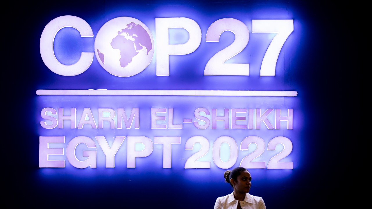 08 November 2022, Egypt, Sharm El-Sheikh: A girl stands in front of the logo of the 2022 United Nations Climate Change Conference COP27, at the International Convention Center. Photo: Gehad Hamdy/dpa (Photo by Gehad Hamdy/picture alliance via Getty Images)