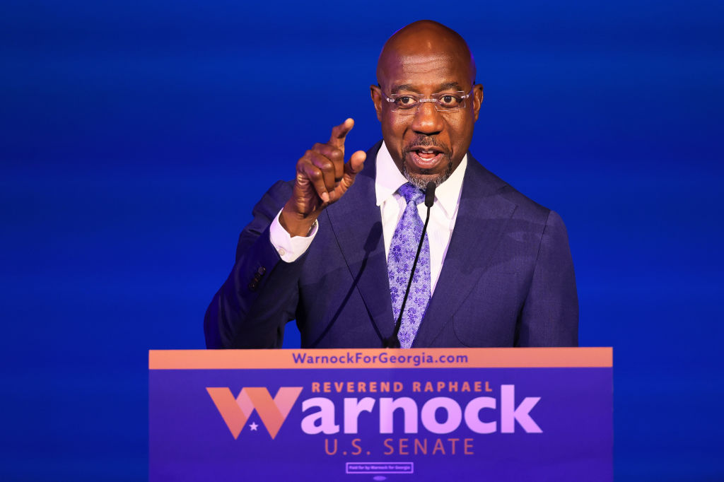 ATLANTA, GEORGIA - NOVEMBER 08: Sen. Raphael Warnock (D-GA) gives a speech at his Election night party at Atlanta Marriott Marquis on November 08, 2022 in Atlanta, Georgia. Sen. Warnock is in a very tight race with Republican challenger Herschel Walker. If neither candidate receives 50 percent plus one vote needed, they will head to a runoff in December. (Photo by Michael M. Santiago/Getty Images)
