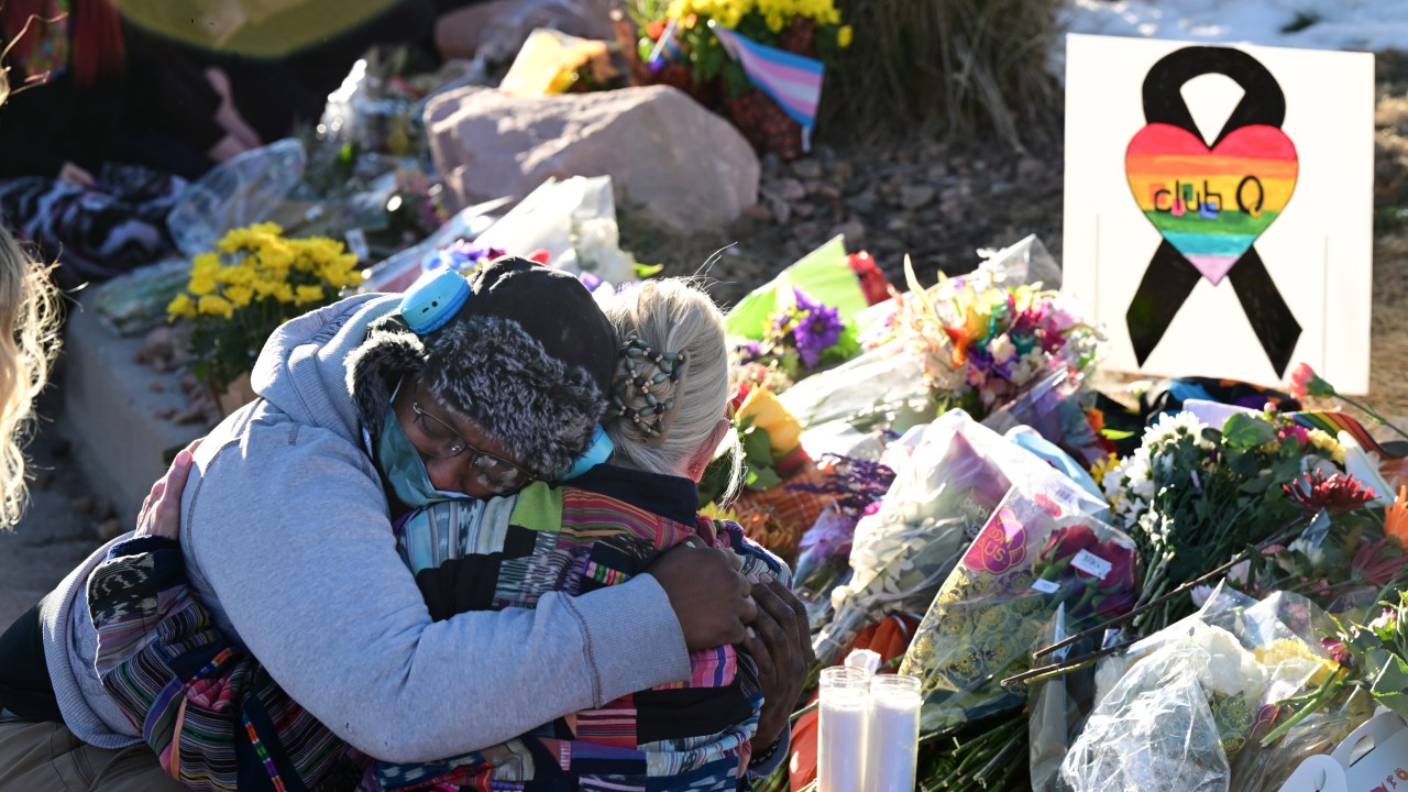COLORADO SPRING, CO - NOVEMBER 20: Justice Lord gets comforted by a friend at a makeshift memorial near Club Q on November 20, 2022 in Colorado Springs, Colorado. An attacker opened fire in a gay nightclub late Saturday night killing five people and wounding at least 25, officials said. The club said the suspect was subdued by patrons and Colorado Springs police said he was taken into custody and hospitalized for treatment of his injuries. Colorado Springs police Chief Adrian Vasquez identified the suspect as 22-year old Anderson Lee Aldrich. (Photo by via Getty Images)