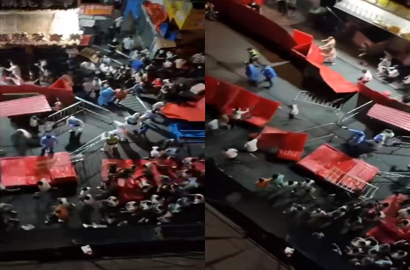 Imagens de redes sociais mostram multidões derrubando barricadas colocadas pelo governo como forma de conter o surto de Covid em andamento em cidades na China. 15/11/2022