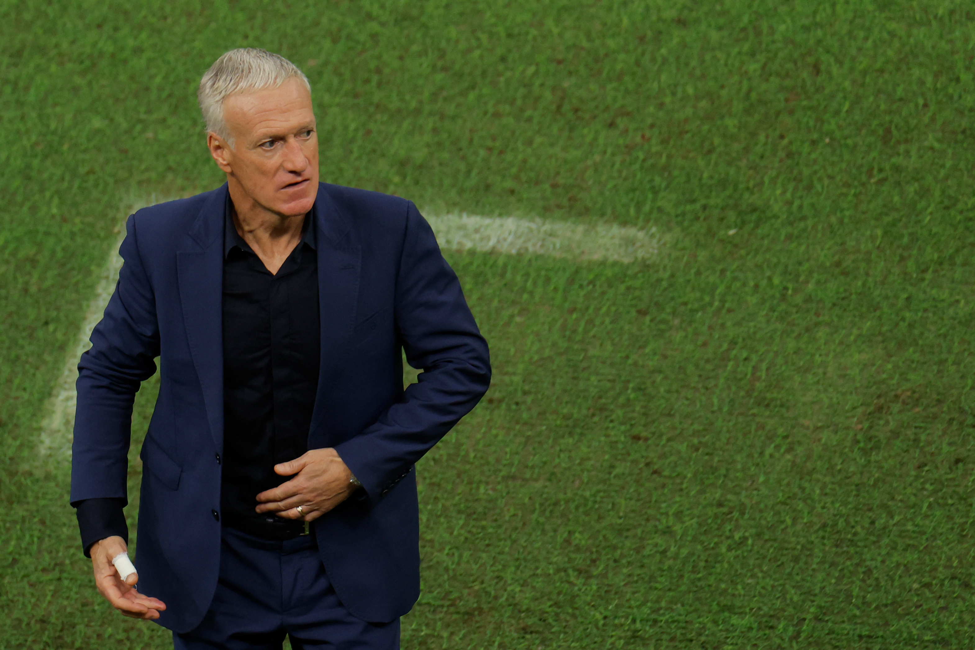 France's coach Didier Deschamps watches his players from the touchline during the Qatar 2022 World Cup football final match between Argentina and France at Lusail Stadium in Lusail, north of Doha on December 18, 2022. (Photo by Odd ANDERSEN / AFP)