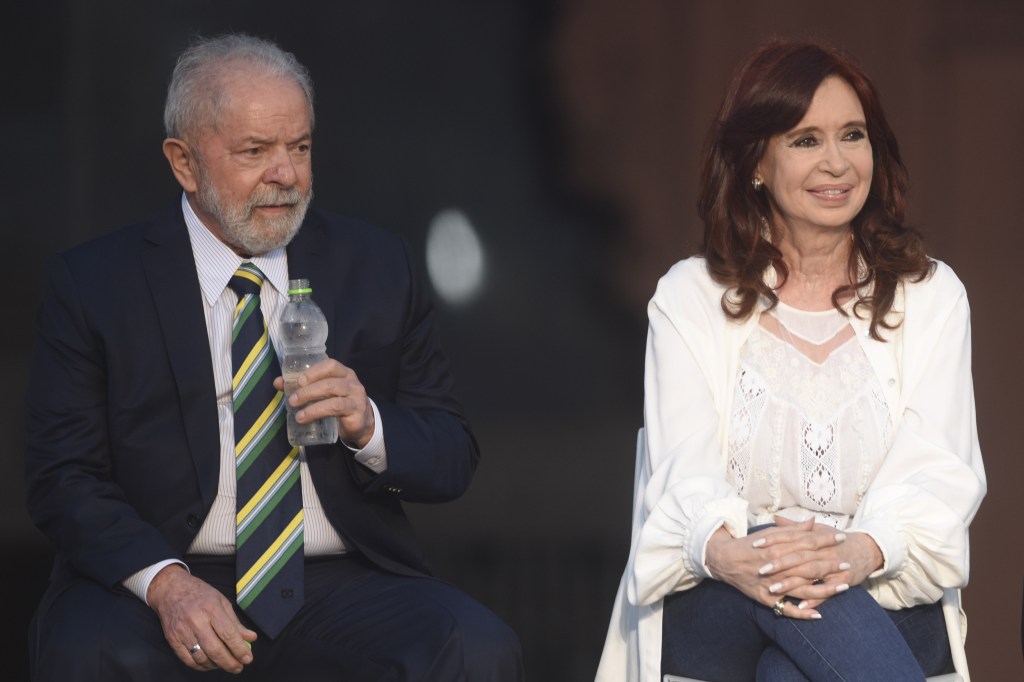 BUENOS AIRES, ARGENTINA - DECEMBER 10: Former President of Brazil Ignacio Lula Da Silva (L), former President of Argentina, Cristina Fernandez de Kirchner and Argentine President, Alberto Fernandez during the act for 38 years of democracy, in Buenos Aires, Argentina, on December 10, 2021. (Photo by Mariano Gabriel Sanchez/Anadolu Agency via Getty Images)