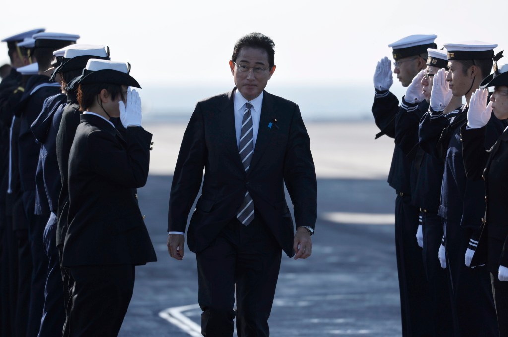 YOKOSUKA, JAPAN - NOVEMBER 06: Japanese Prime Minister Fumio Kishida is saluted by members of the Japan Maritime Self-Defence Force during an International Fleet Review commemorating the 70th anniversary of the founding of the Japan Maritime Self-Defence Force at Sagami Bay on November 6, 2022 off Yokosuka, Japan. The Japan Maritime Self-Defence Force (JMSDF) is commemorating the 70th anniversary of their founding today. (Photo by Issei Kato - Pool/Getty Images)